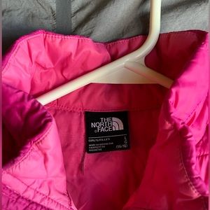 pink north face jacket.